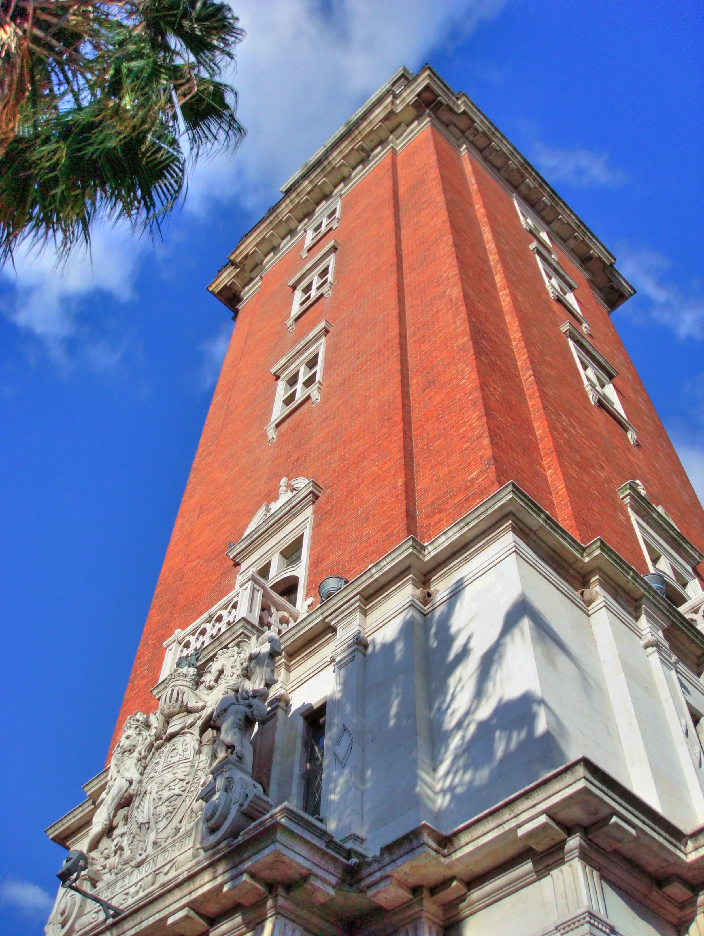 Historic tower photographed from near its base as it rises into a vivid blue sky in Buenos Aires, titled The Ascent by Francisco Colón.